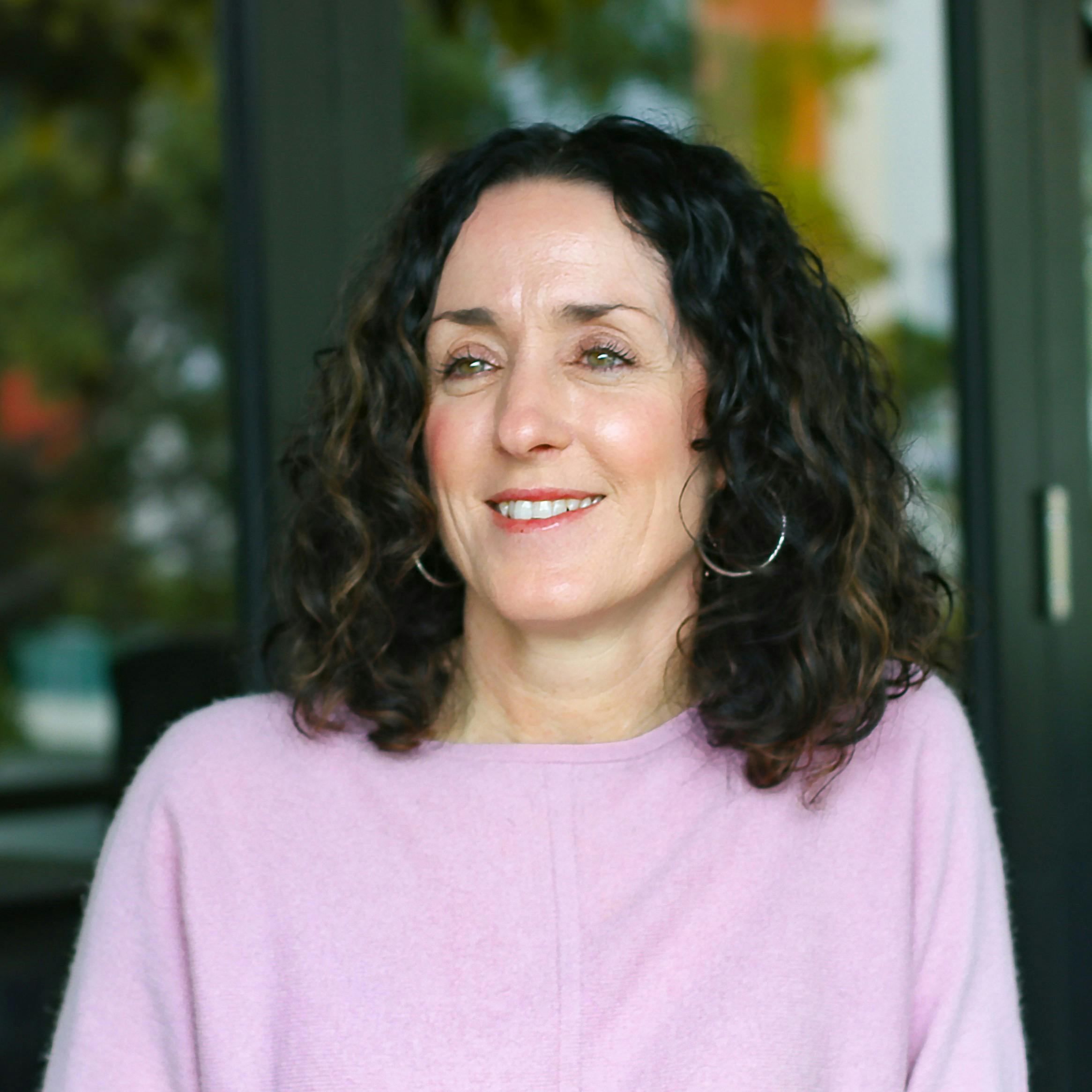 Photo of Anna Chipperfield in pink shirt smiling